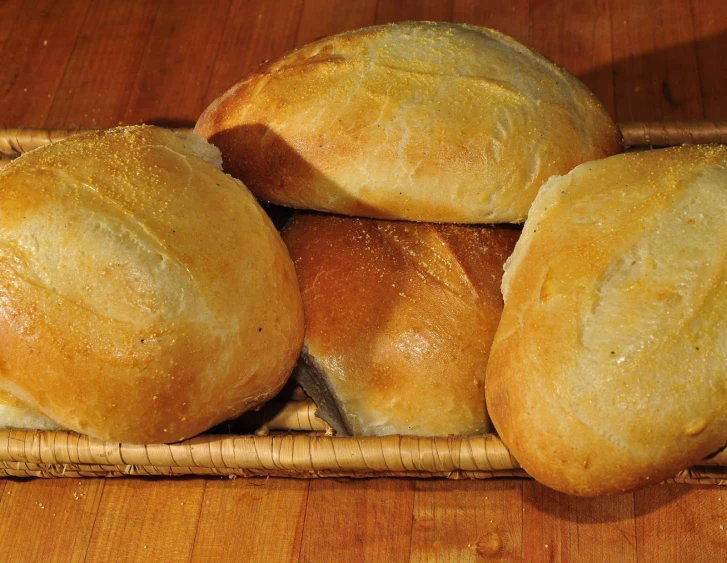 the basket contains a few rolls, which are stuffed in a thick dough