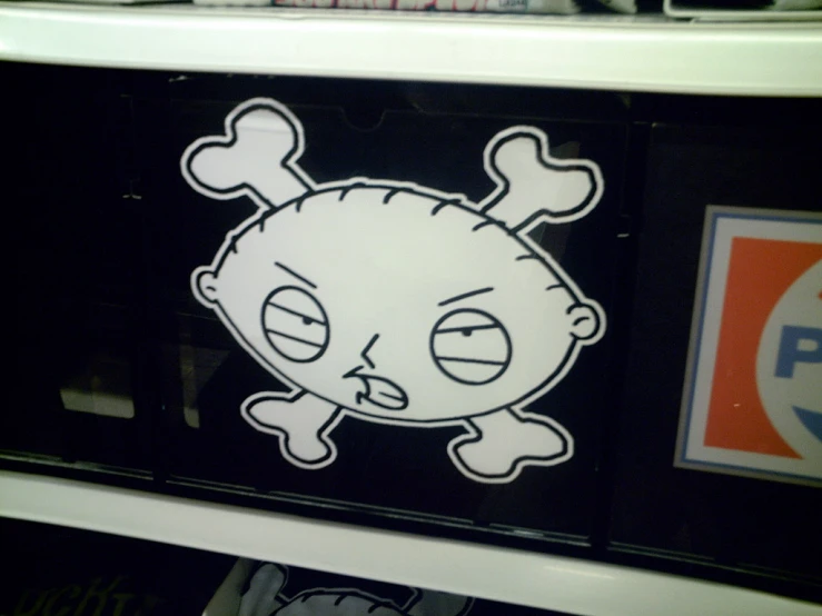 a cartoon sticker of a little cartoon with skull bones on the bottom