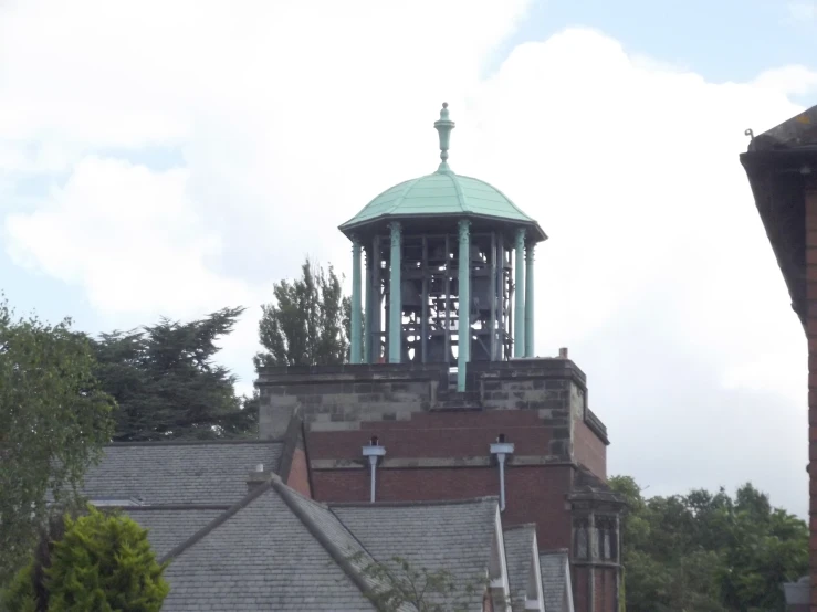 there is a very tall clock tower atop the building