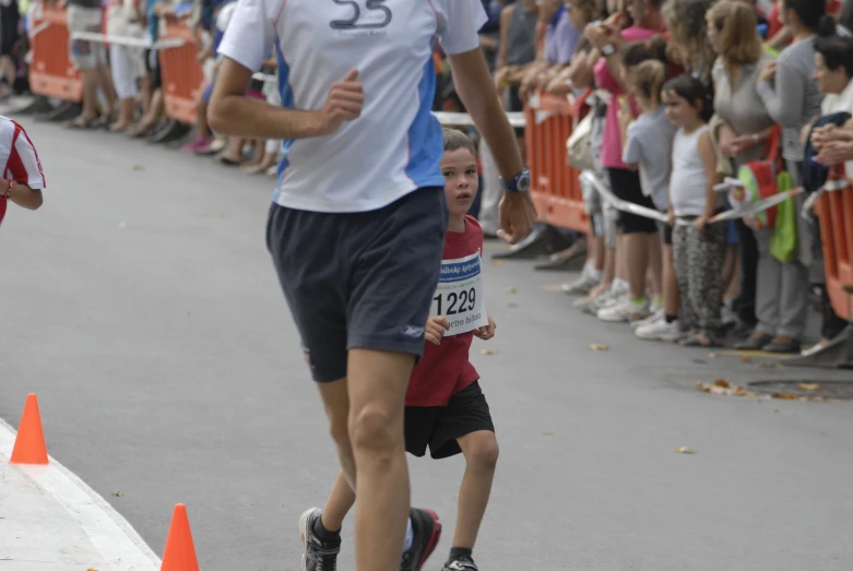 a  running in a race near an adult