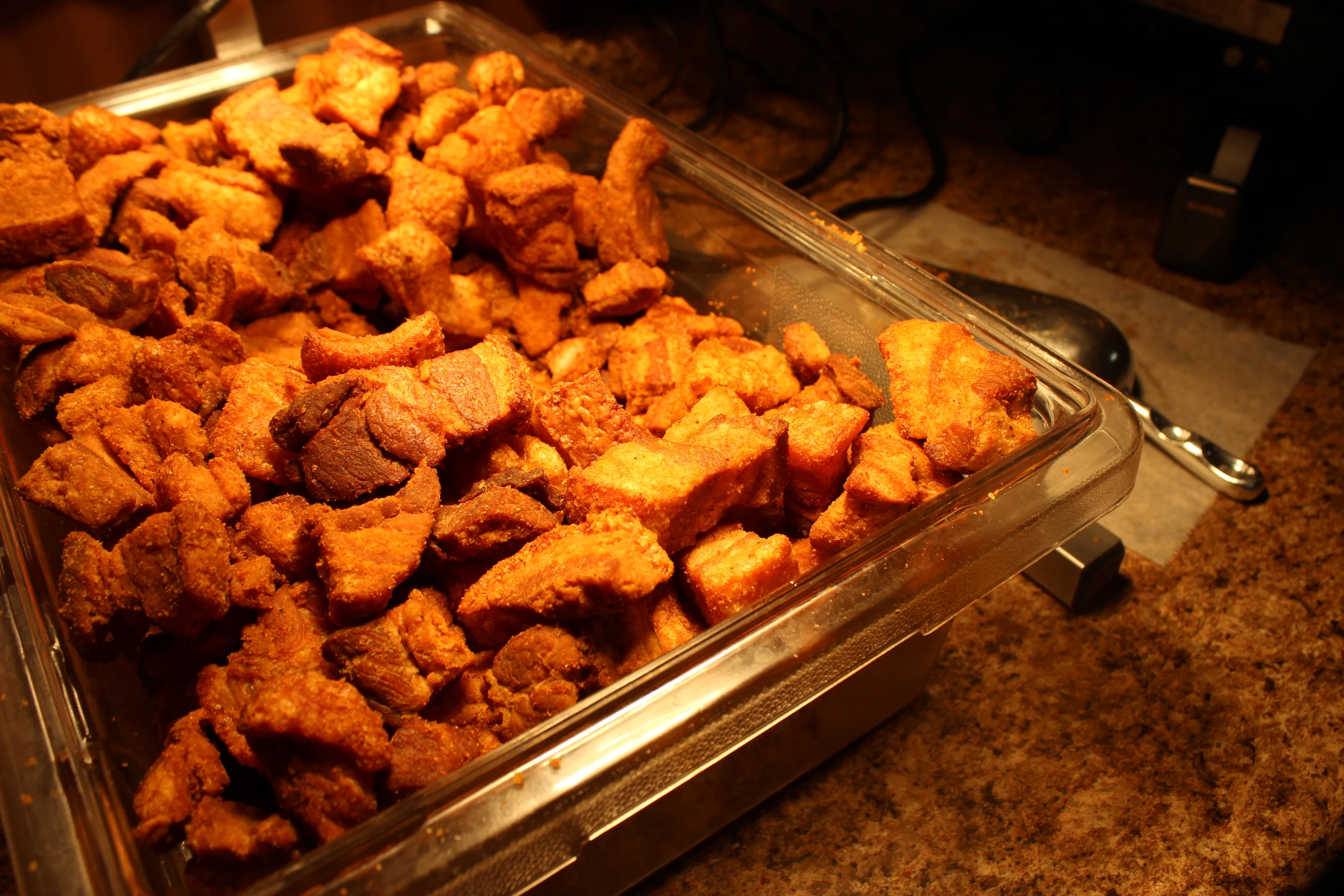 some food is in a glass tray on a counter