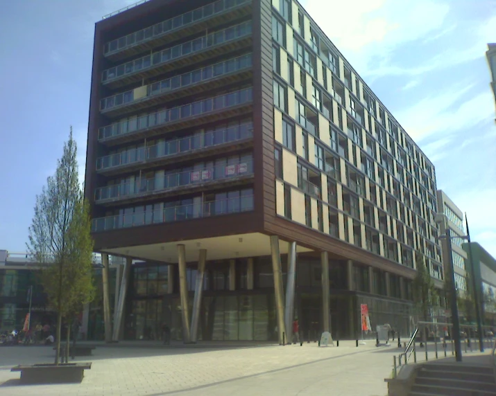 a large building on a corner in front of the street