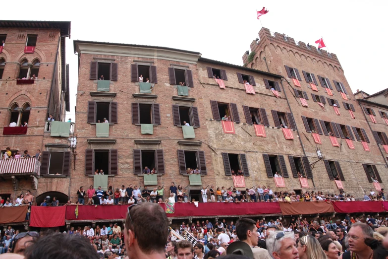 a large crowd gathered in front of a building