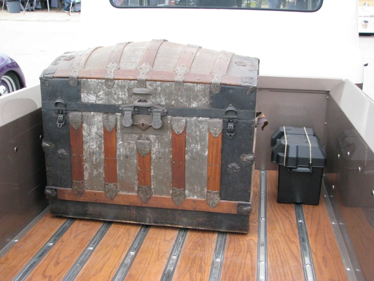 a trunk is placed inside a truck bed