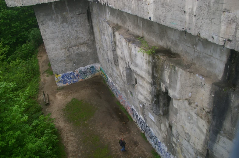 an aerial s of a narrow building with graffiti on the walls