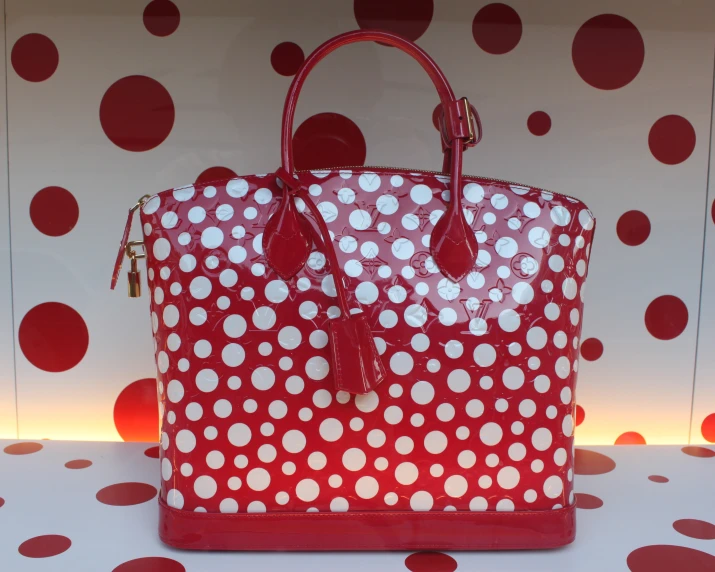 red polka dot bag and white dots on background