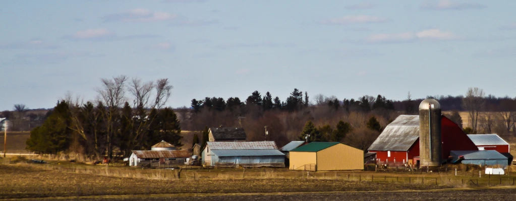 a number of farm buildings near one another