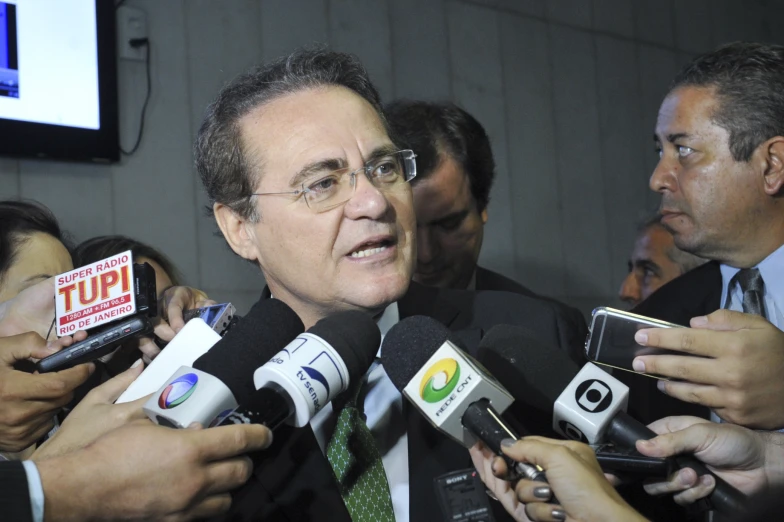 a man speaking to reporters at a news conference