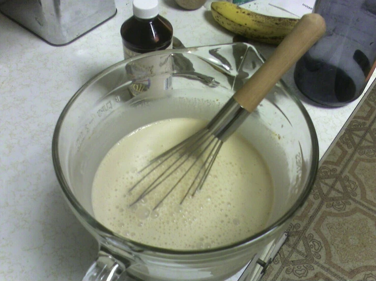 a mixing bowl containing a mixture with some ingredients