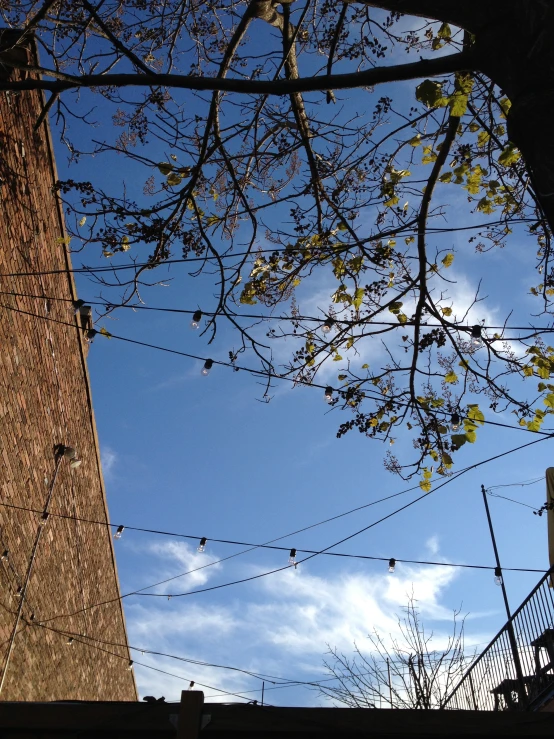 a brick building in front of a blue sky