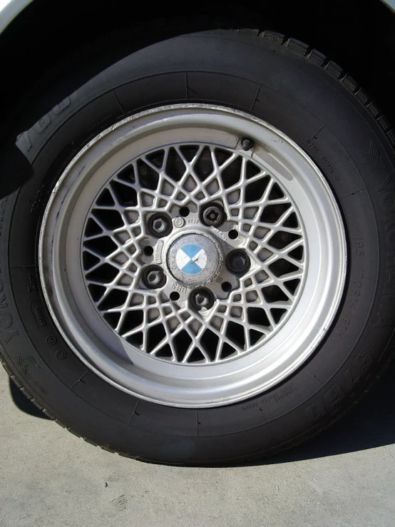 a close up of the wheels and spokes of a car