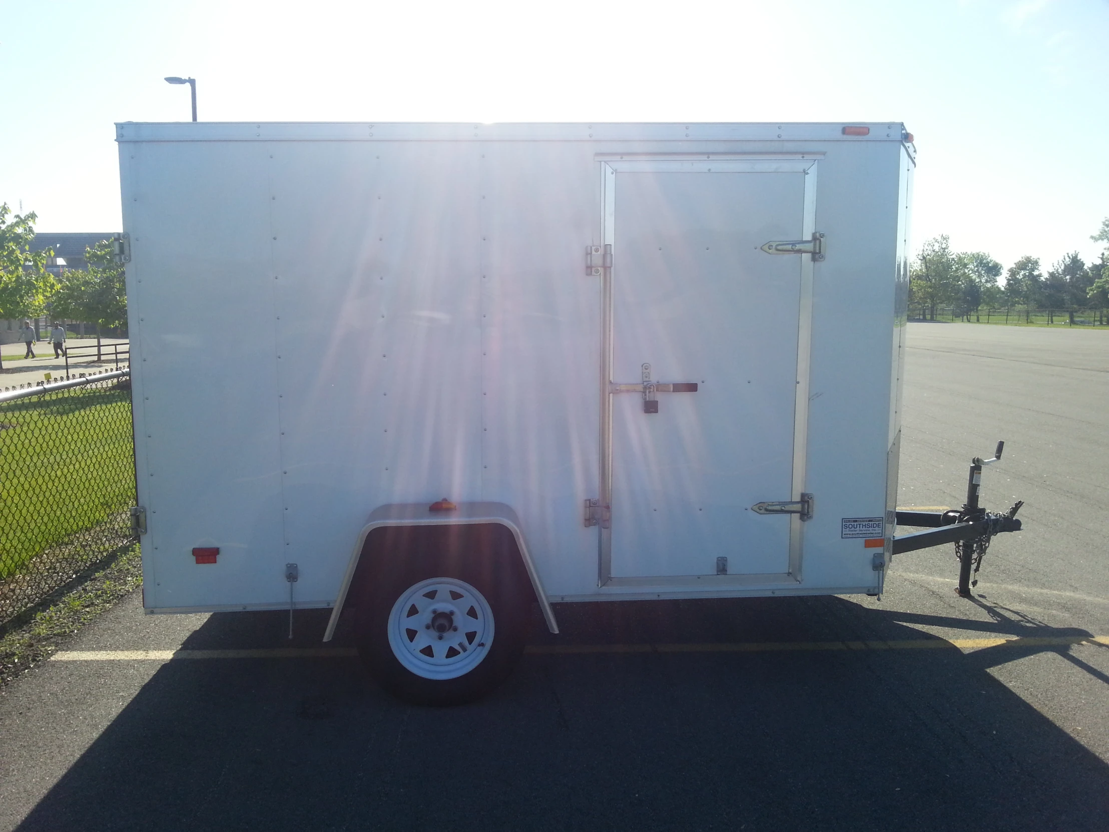 a large trailer parked in the parking lot with the door open