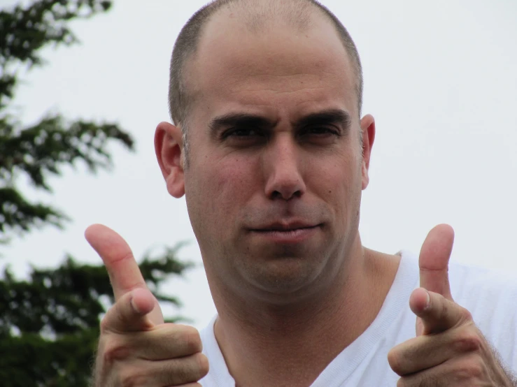 a close up of a person wearing a white shirt