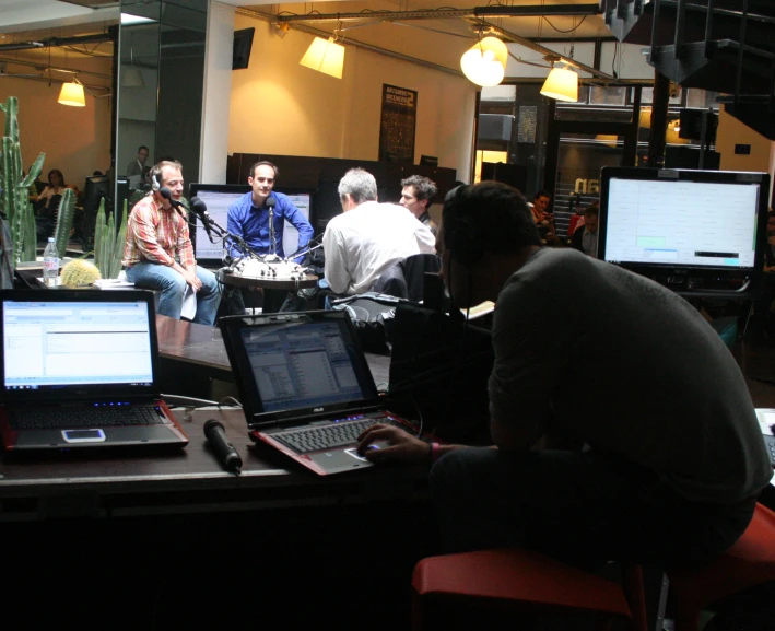 group of people gathered in an office talking