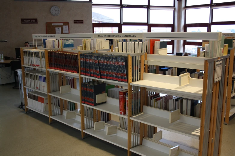 a view of a bookshelf inside of an office building