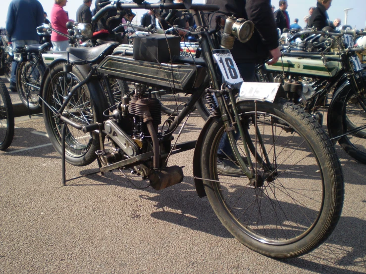 a motorcycle is parked among other motorcycles on the ground