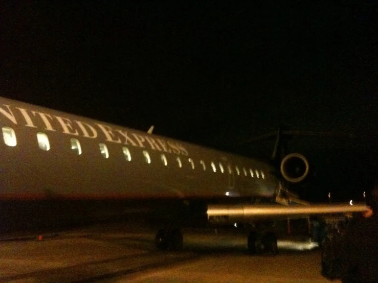 people walking out from the plane onto the runway