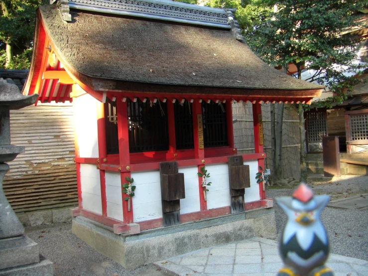 a small building with bellows on each side