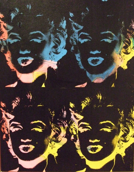 art print with different woman's faces and black and yellow colors