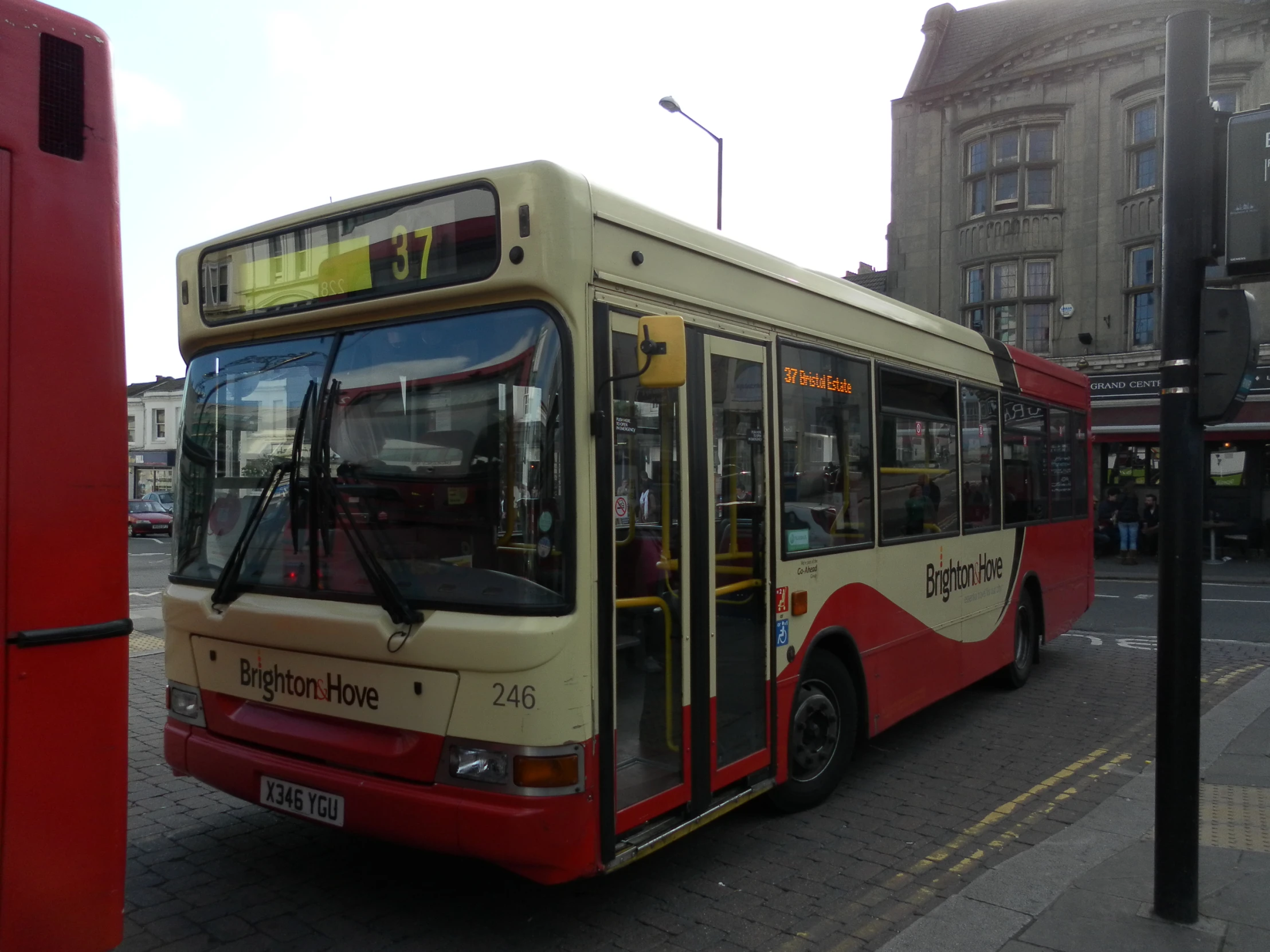 the city bus drives down the empty street