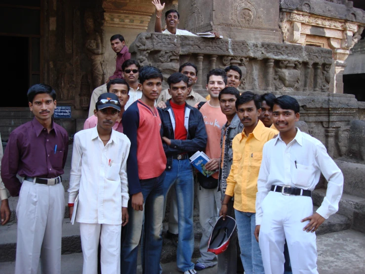 many men posing for a po in a group