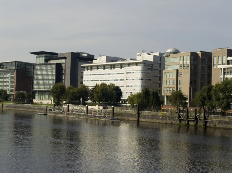 a waterway with buildings and trees on the side