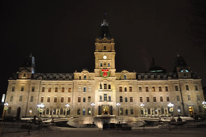 a building lit up at night with lights on