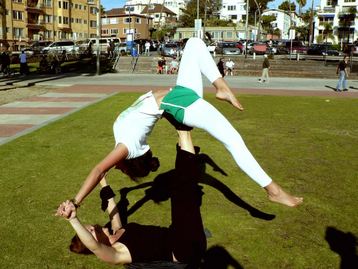 two dancers in motion in front of a crowd