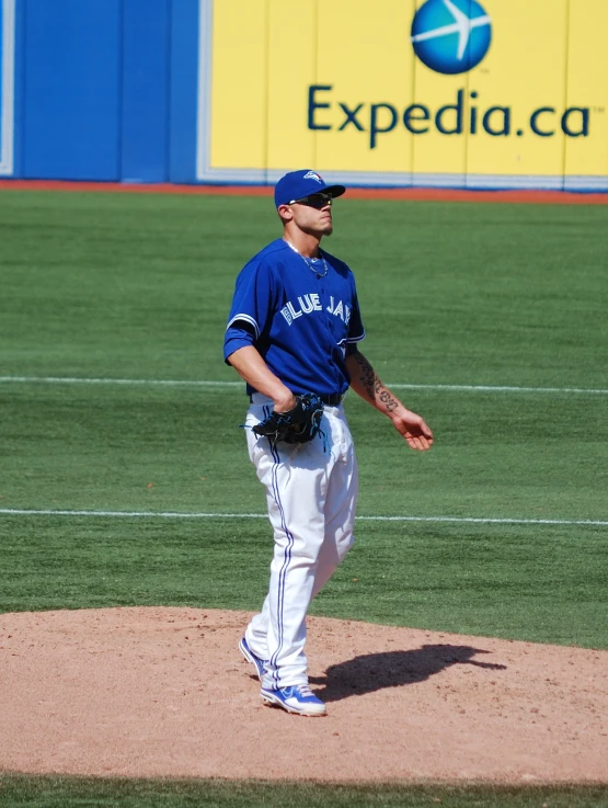 a baseball player on the mound getting ready to pitch the ball