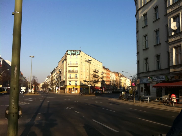 the street of a city with people on sidewalks