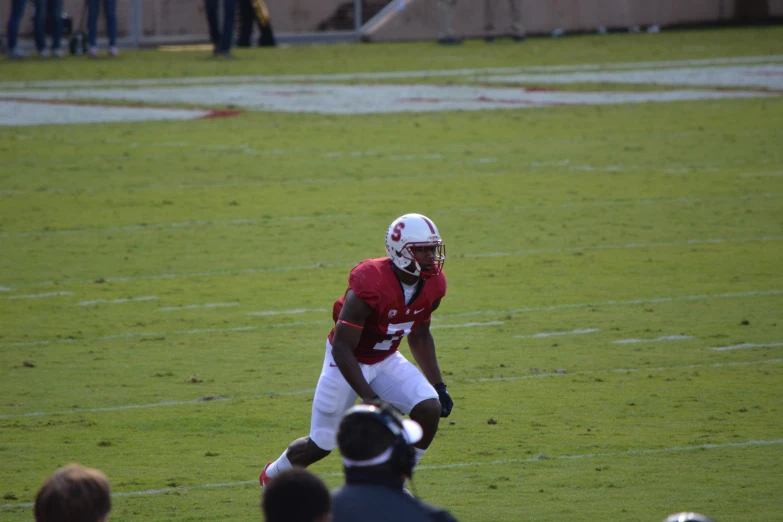 a football player is running with the ball