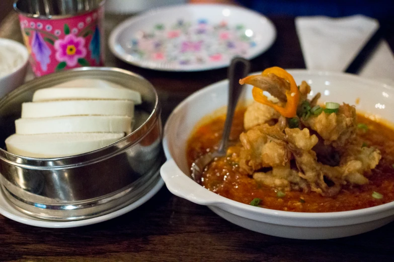 there is a bowl that is filled with meat and vegetables