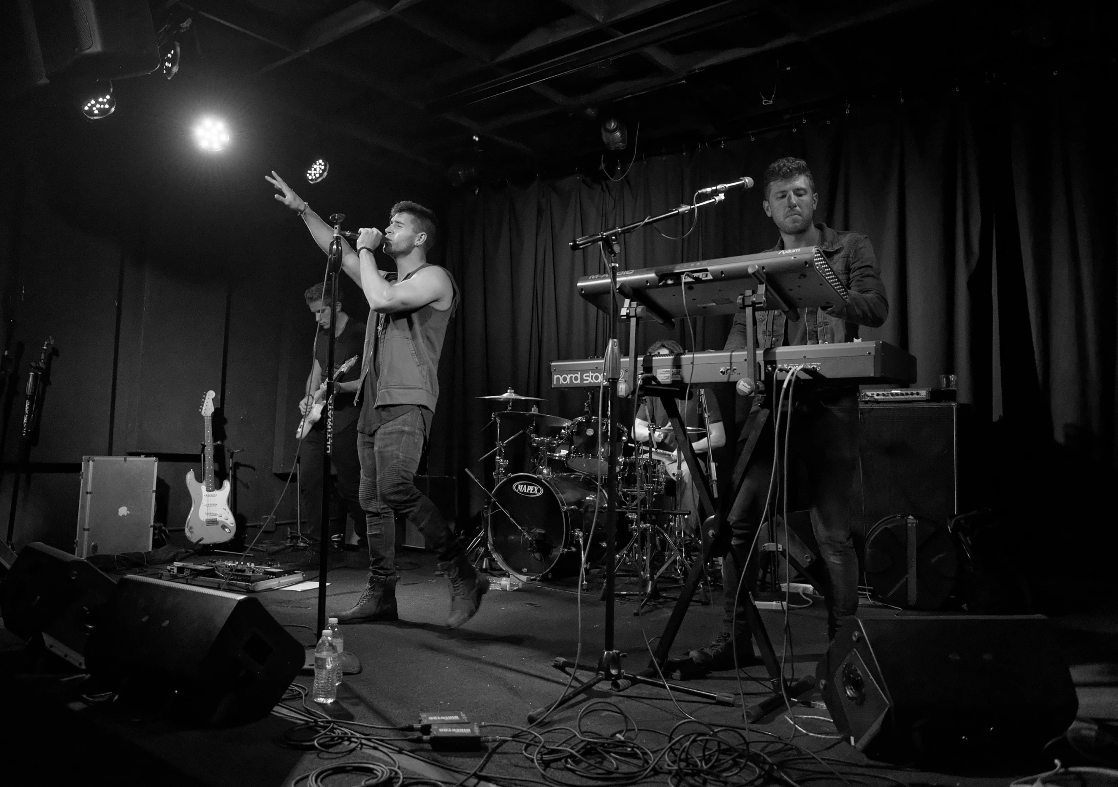 band playing music in black and white po