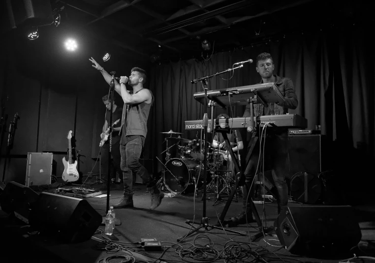 band playing music in black and white po