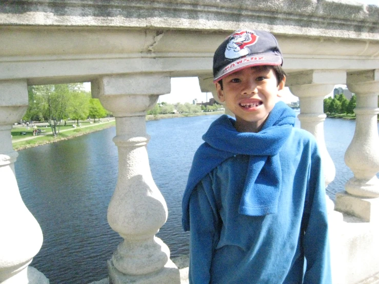 a  standing next to a large body of water