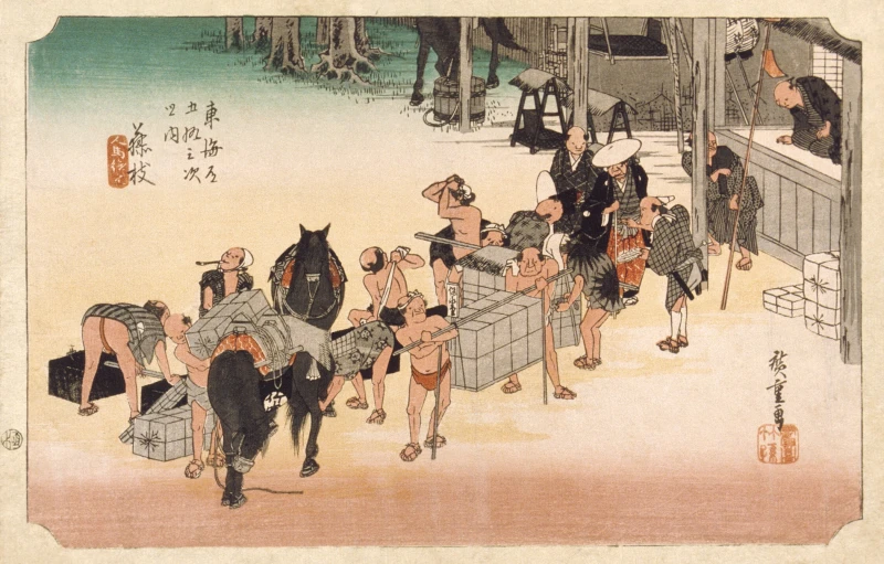 a group of people are gathered around an open gate with two horses