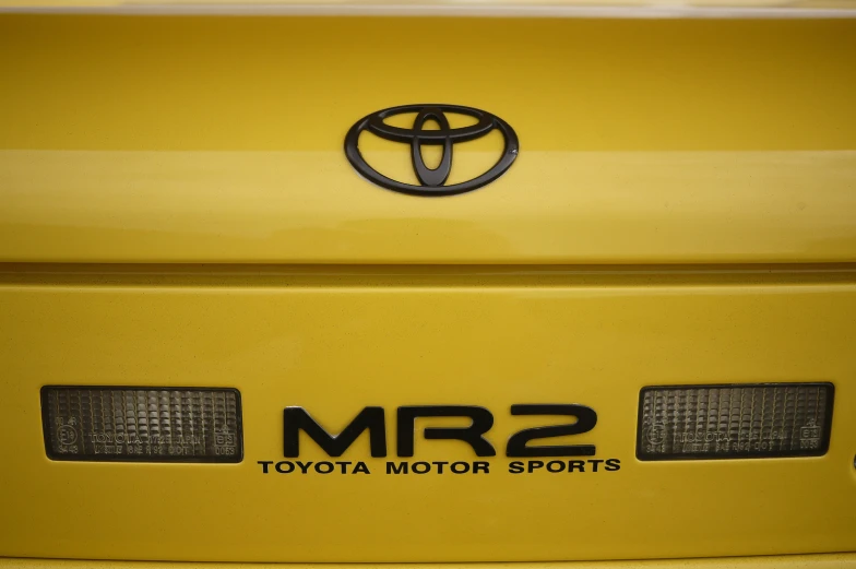 front view of a yellow toyota mr2 sports car