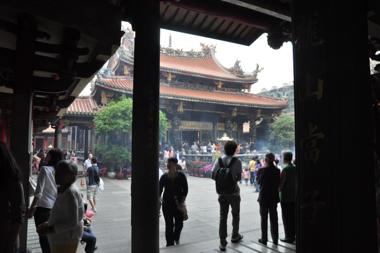 several people walking through an oriental area