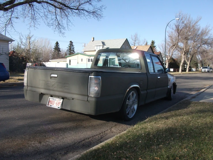 an old pick up truck parked on the street