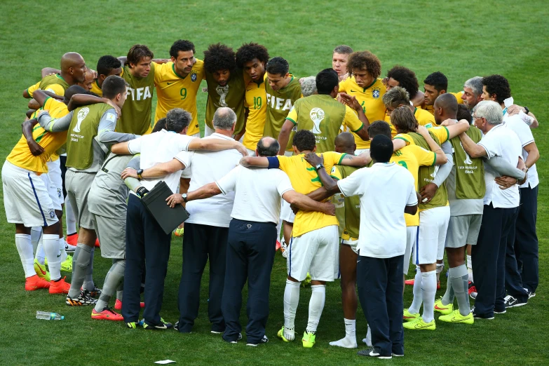 a group of soccer players hugging each other