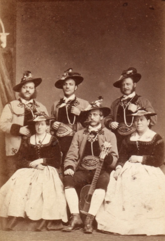 black and white portrait of men, women and children in costume