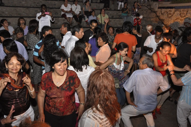 group of people dancing in an indoor area