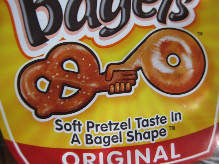 a bagel advertit has the word bagels and pretzels in a huge shape
