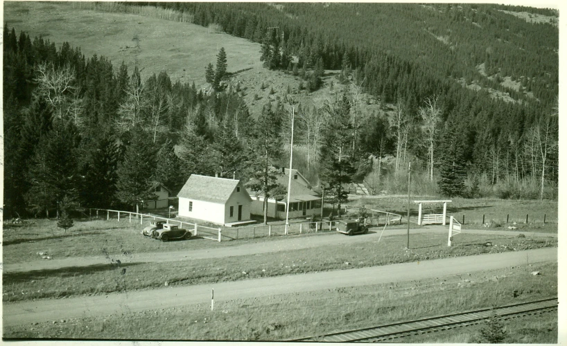 a rural area with houses, and mountains