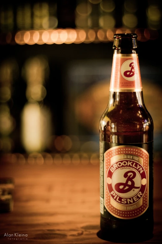 a beer that is sitting on a wooden table