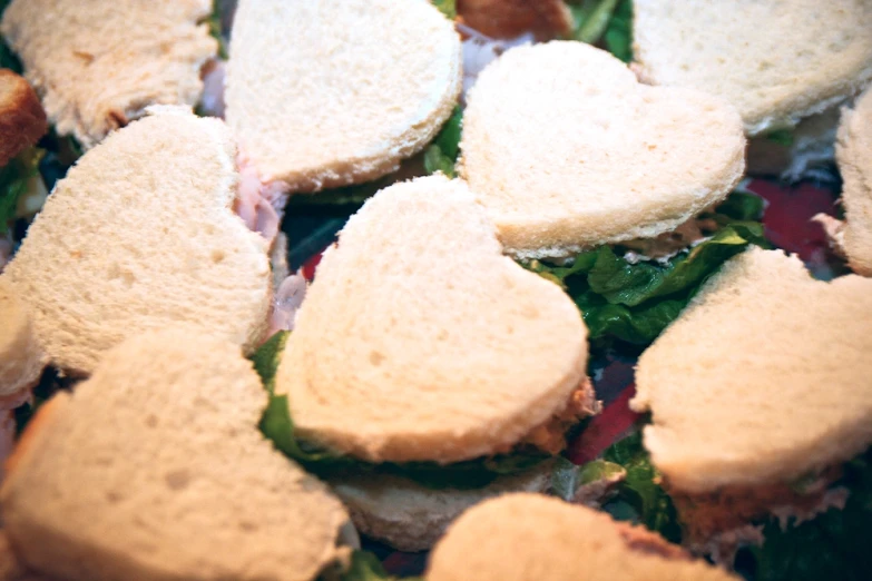 a close up s of mini sandwiches on a tray