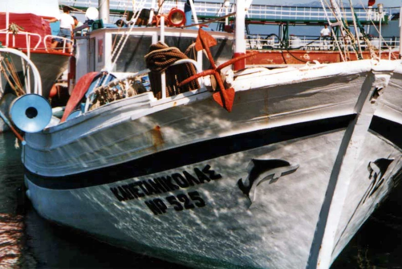 the side of an old boat that has been painted white