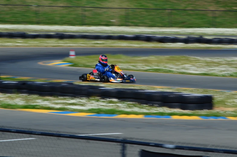 a racing go - cart in the process of turning a curve
