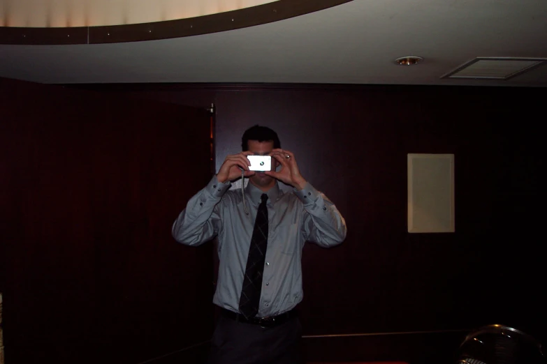 a man taking a selfie in his business suite