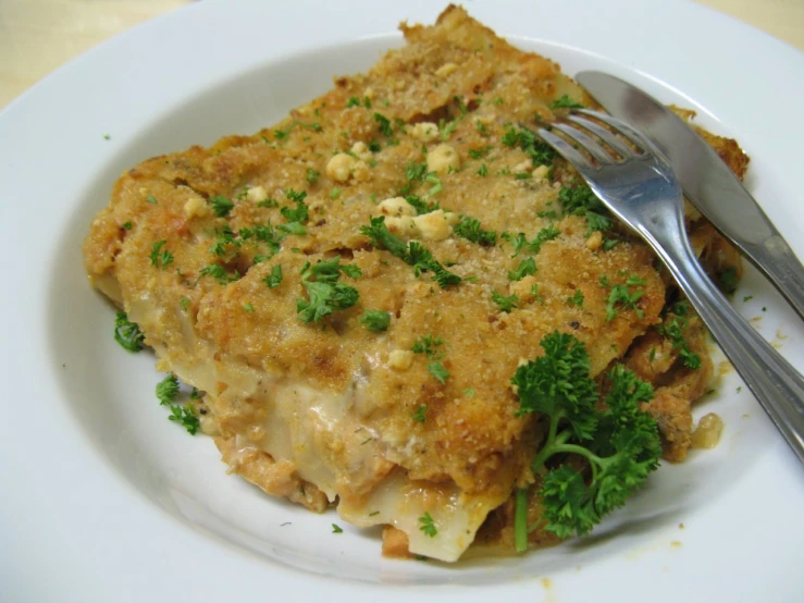 the plate is filled with food and silverware